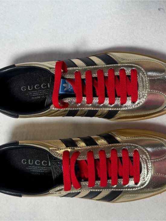 Gucci Shoes - Gucci Metallic Gold Sneakers with Black Stripes and Red Laces